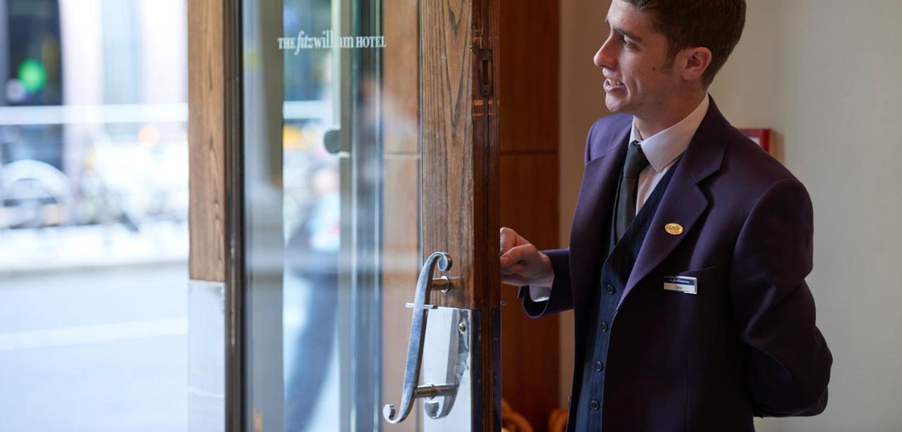 The Fitzwilliam Hotel Dublin Exterior photo A doorman at The New Albany Hotel